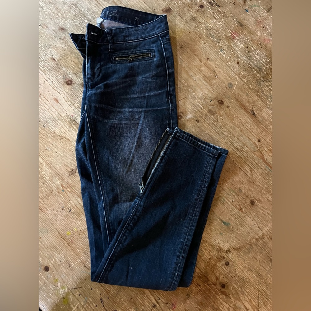 Skinny jeans with zippered ankles and pockets